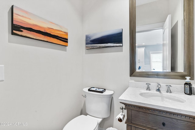 445 E Third St, Ocean Isle Beach, NC 28469 - bathroom featuring vanity and toilet