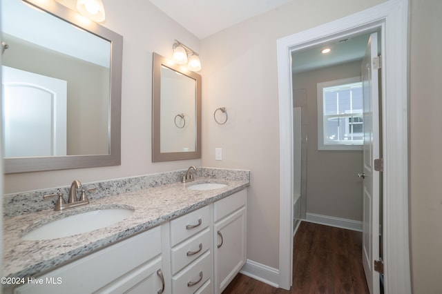 bathroom featuring vanity and wood-type flooring