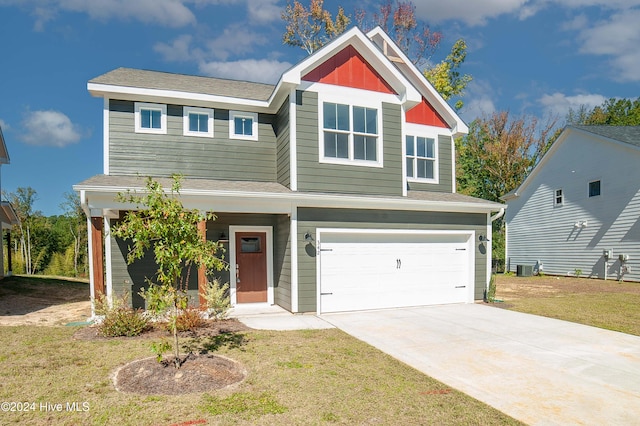 craftsman-style home featuring central air condition unit, a front yard, and a garage