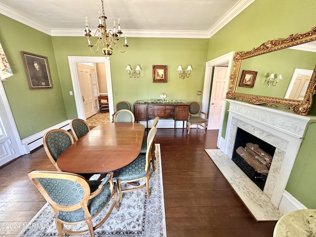 dining space with a notable chandelier, crown molding, a premium fireplace, a baseboard heating unit, and dark wood-type flooring