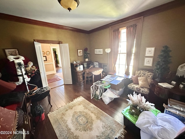 home office with ornamental molding and dark wood-type flooring