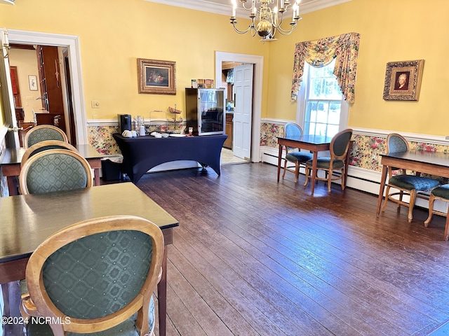 interior space featuring dark wood finished floors, a wainscoted wall, baseboard heating, crown molding, and a notable chandelier