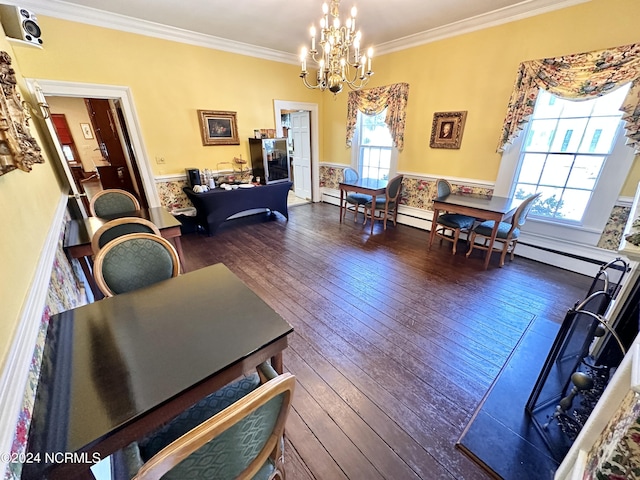 dining room featuring a notable chandelier, dark wood-type flooring, wainscoting, and crown molding