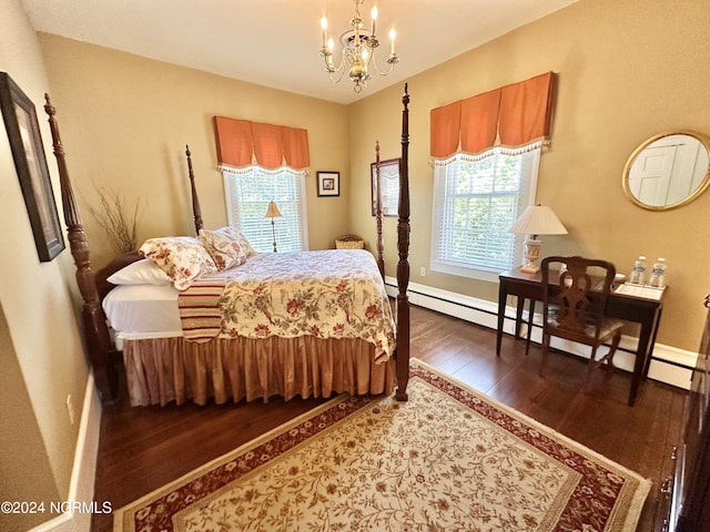 bedroom featuring a chandelier, baseboards, baseboard heating, and wood finished floors