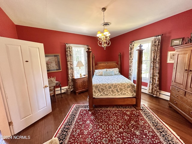 unfurnished bedroom featuring dark wood-type flooring, a baseboard radiator, visible vents, and an inviting chandelier