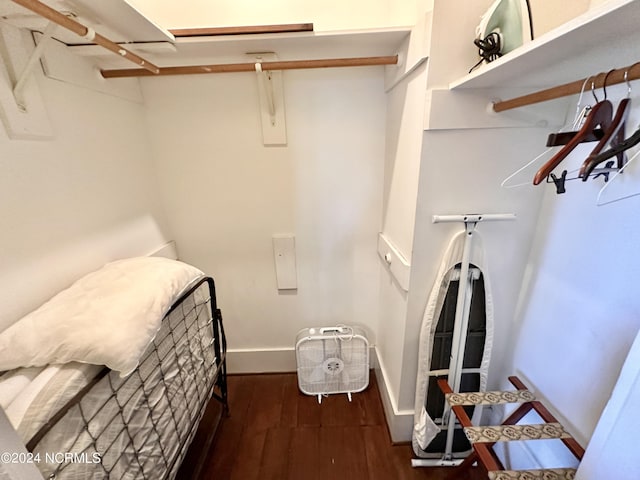 spacious closet featuring dark wood-type flooring