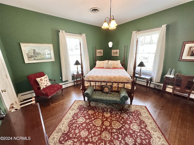 bedroom with dark wood-style floors, a baseboard radiator, visible vents, and an inviting chandelier