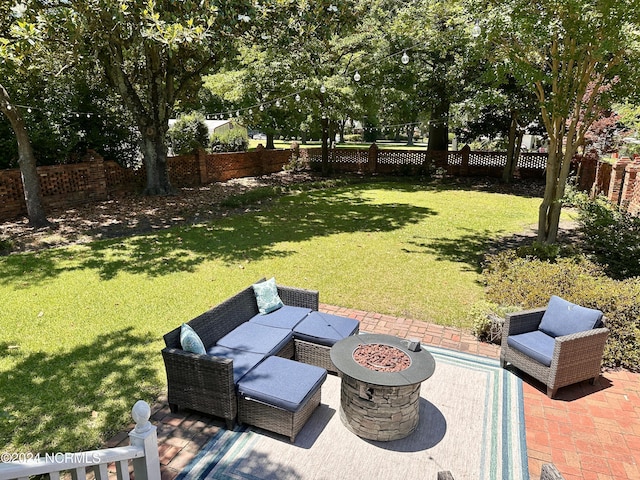 view of yard with a patio, an outdoor fire pit, and a fenced backyard