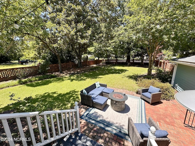 view of yard with a patio area, an outdoor fire pit, and a fenced backyard