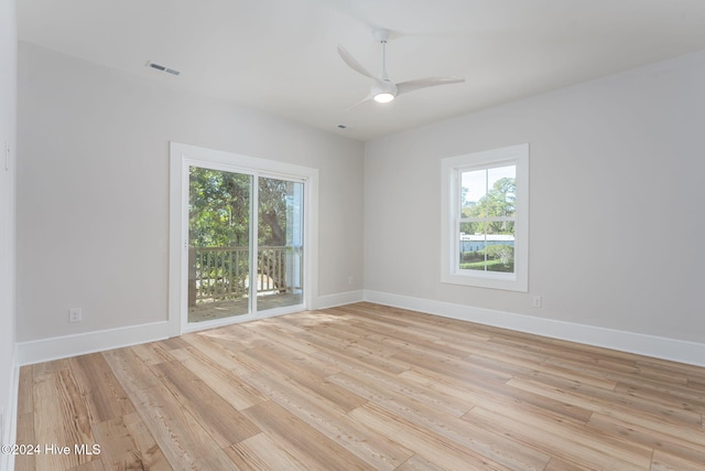 unfurnished room featuring light hardwood / wood-style floors and ceiling fan