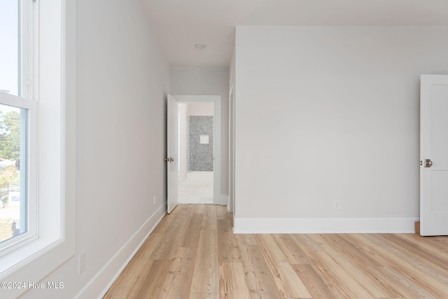 hall with light hardwood / wood-style floors