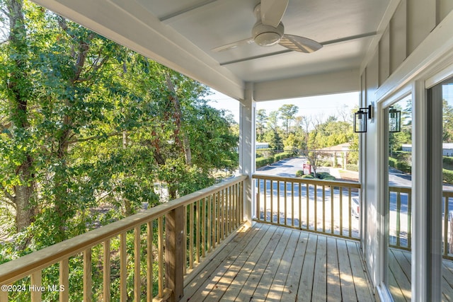 wooden deck featuring ceiling fan