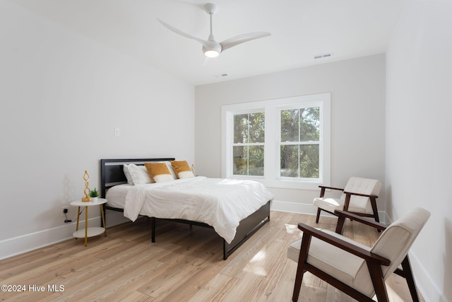 bedroom featuring light hardwood / wood-style flooring and ceiling fan