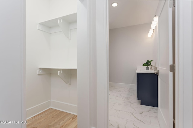 interior space with wood-type flooring and vanity