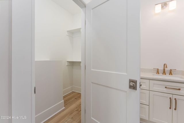 112 Seagate Pl, Wilmington, NC 28403 - bathroom with wood finished floors, vanity, and baseboards