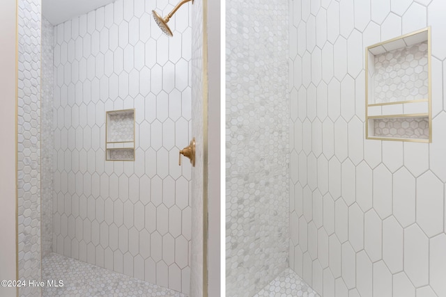 bathroom with tiled shower