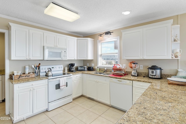 kitchen with white cabinets and white appliances