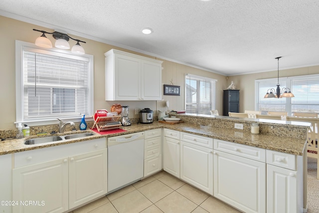 kitchen featuring dishwasher, a textured ceiling, sink, and kitchen peninsula