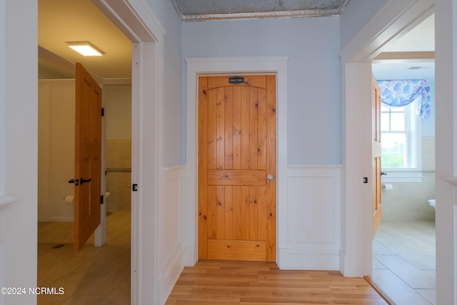 108 Wharf Landing Dr, Edenton, NC 27932 - hallway with light wood-style flooring and a wainscoted wall