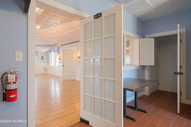 108 Wharf Landing Dr, Edenton, NC 27932 - hallway featuring a wainscoted wall, wood finished floors, and a decorative wall