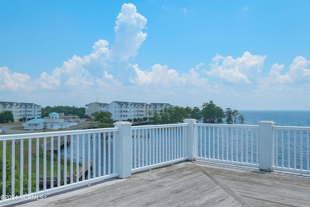 wooden deck with a water view