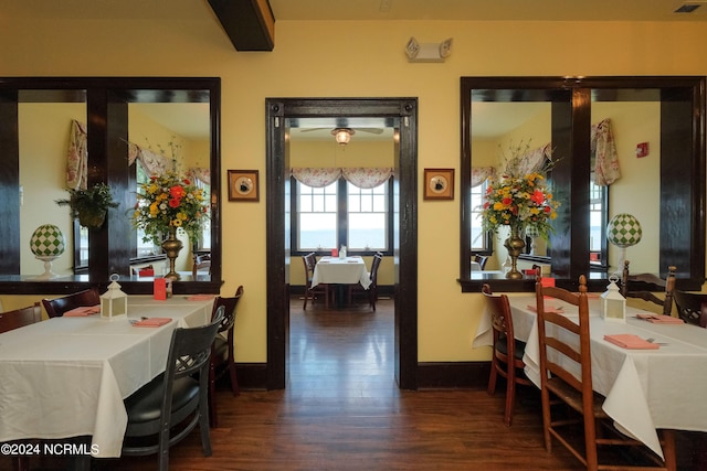 dining area with dark hardwood / wood-style floors