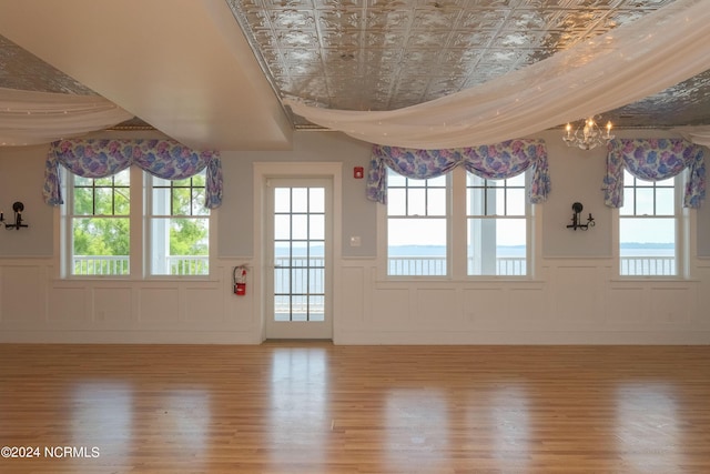 108 Wharf Landing Dr, Edenton, NC 27932 - entrance foyer featuring wainscoting, wood finished floors, an ornate ceiling, and a chandelier