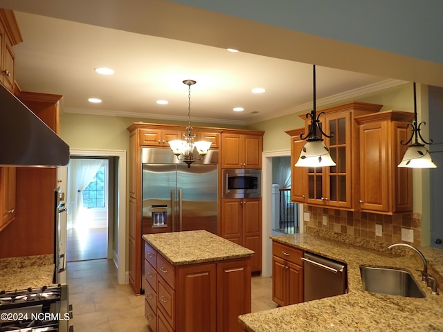 kitchen featuring decorative backsplash, stainless steel appliances, hanging light fixtures, and sink