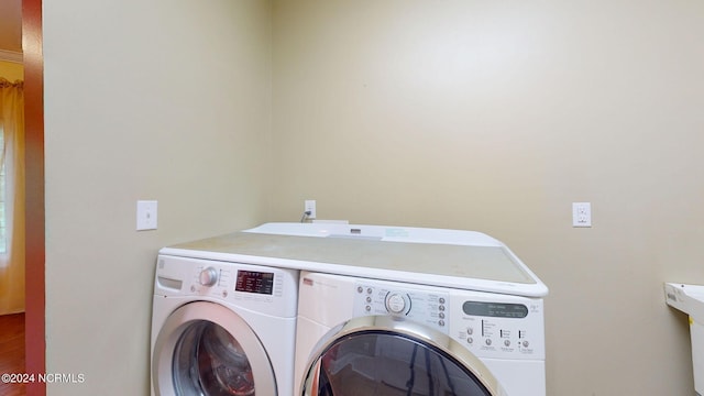 washroom with separate washer and dryer