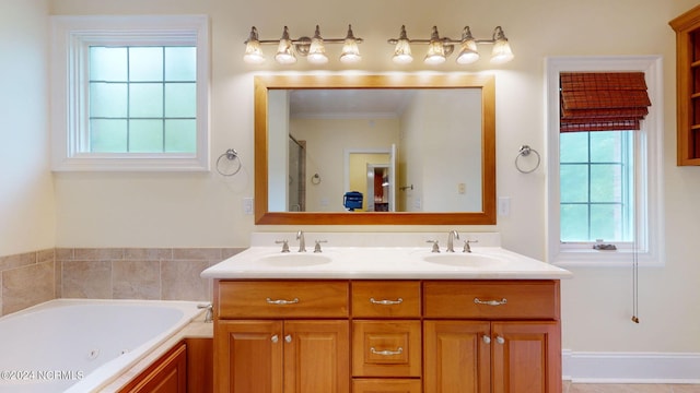 bathroom featuring vanity and shower with separate bathtub