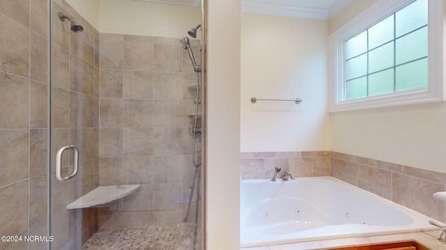 bathroom with crown molding and independent shower and bath