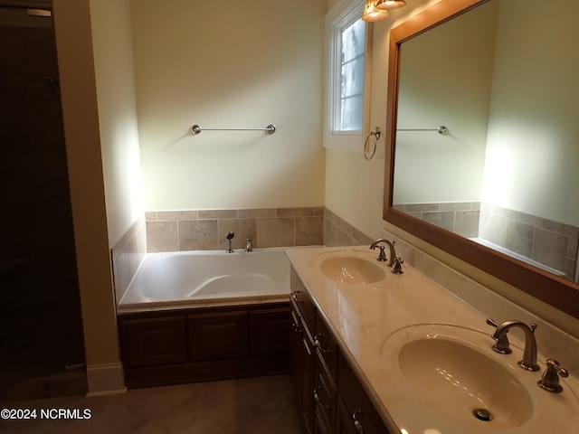 bathroom with a washtub and vanity