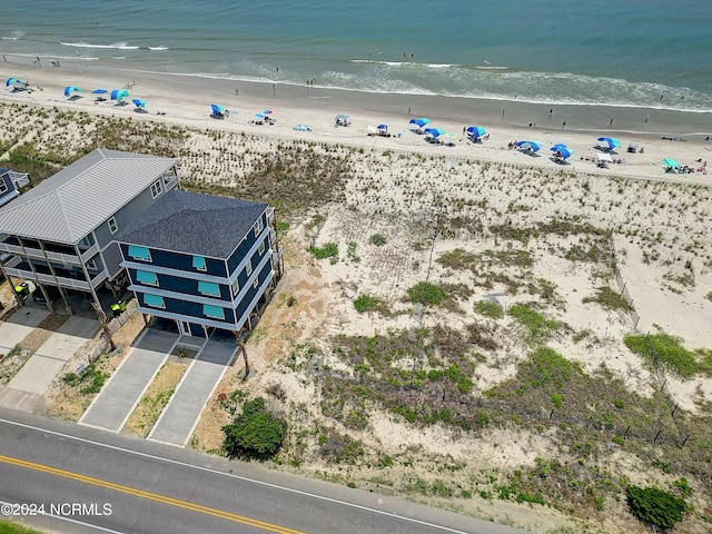 bird's eye view featuring a beach view and a water view