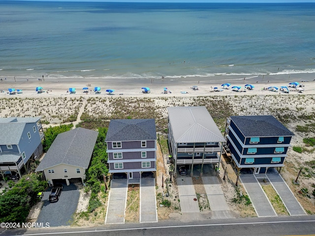 bird's eye view featuring a water view, a residential view, and a beach view