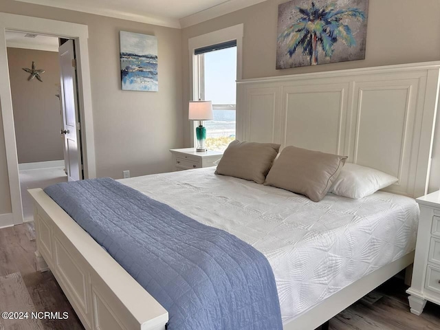 bedroom with dark wood-style floors