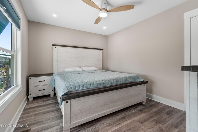 bedroom featuring ceiling fan, baseboards, dark wood-style flooring, and recessed lighting