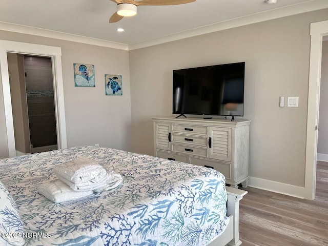 bedroom featuring baseboards, a ceiling fan, crown molding, light wood-type flooring, and recessed lighting