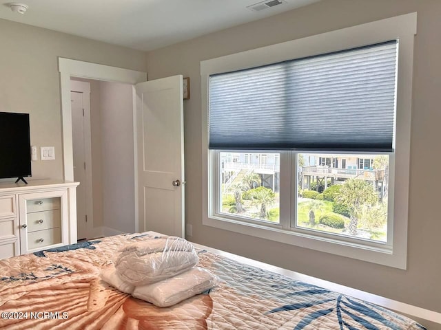 bedroom featuring baseboards