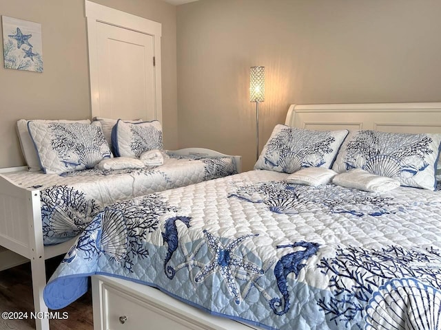 bedroom featuring wood finished floors