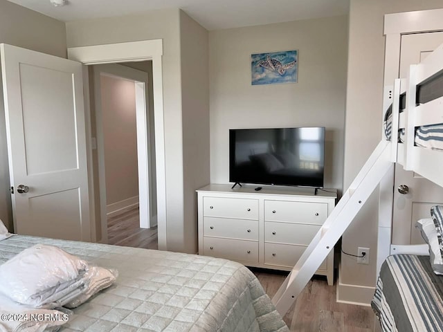 bedroom with wood finished floors