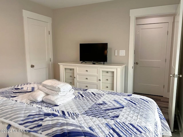 bedroom featuring dark wood-style floors