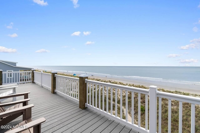 deck featuring a water view and a beach view