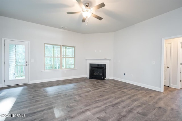 unfurnished living room featuring wood-type flooring and ceiling fan