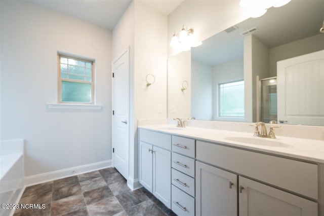 bathroom featuring vanity and shower with separate bathtub