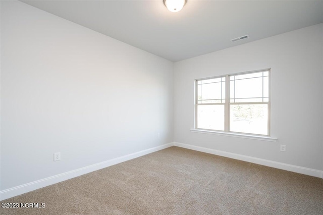 view of carpeted spare room