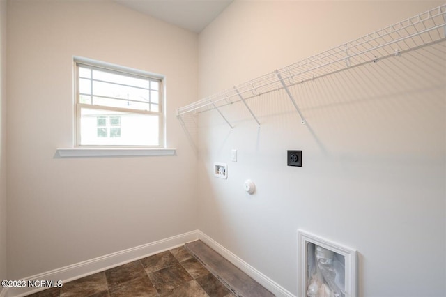 clothes washing area featuring hookup for a washing machine, electric dryer hookup, and hookup for a gas dryer