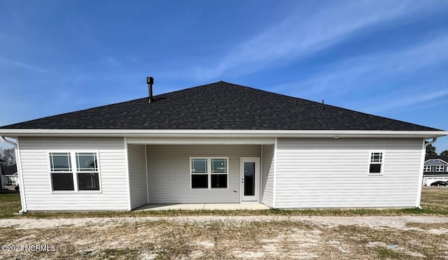 rear view of property featuring a patio area