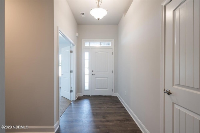 foyer featuring dark wood-type flooring