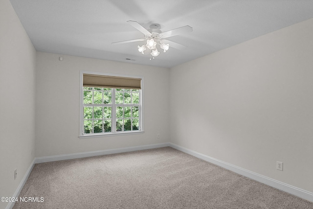 unfurnished room featuring carpet and ceiling fan