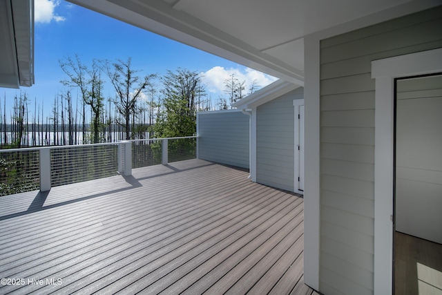 wooden terrace with a water view